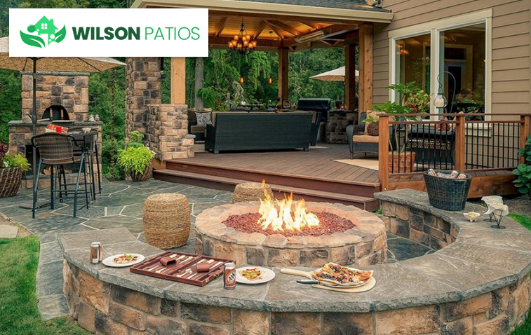 Backyard patio featuring a fire pit, enhancing the cozy atmosphere for outdoor gatherings